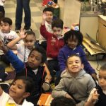 Kindergarten Students raising their hands