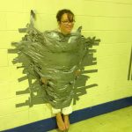 Mrs. Gomez taped to a wall