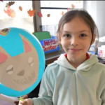 2nd Grader Emma with her Wolf Balloon