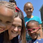 Teacher and students smiling