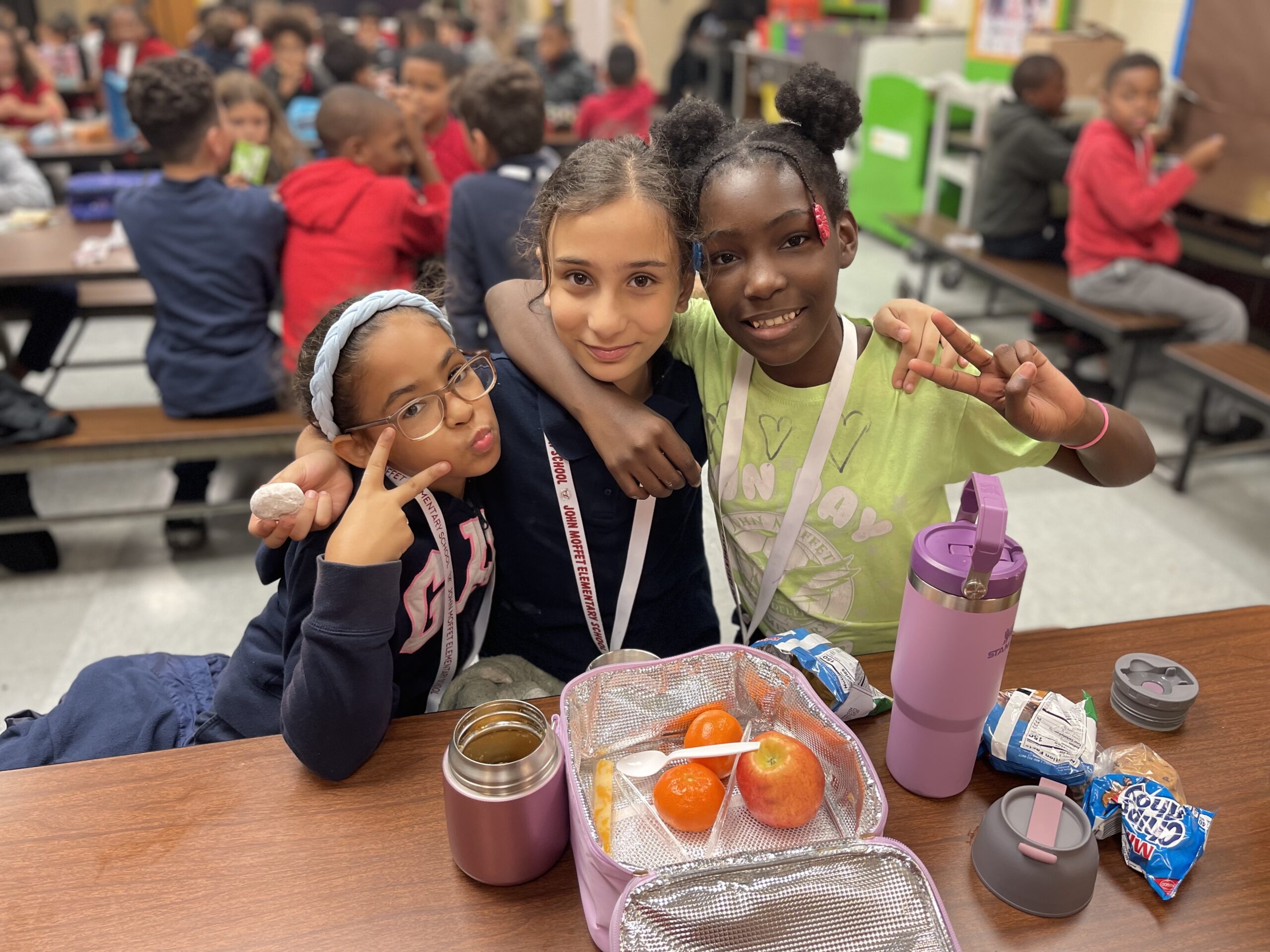 Three girls enjoying lunch